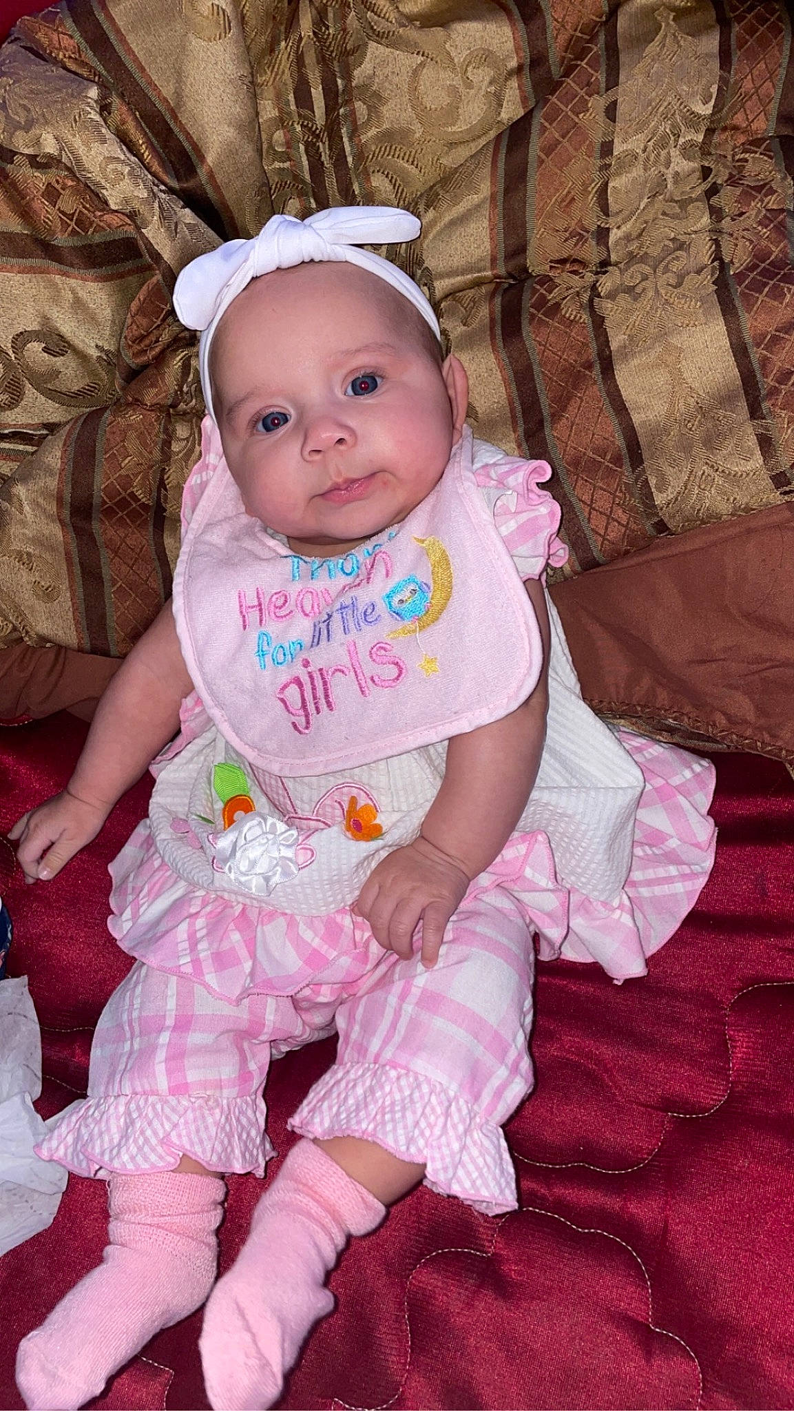 Everlee is registered to the contest to win money with this photo: baby, baby_products, baby_toddler_clothing, cheek, child, comfort, eyelash, facial_expression, fashion_accessory, grass, happy, headwear, magenta, pattern, peach, person, pink, sitting, skin, sleeve