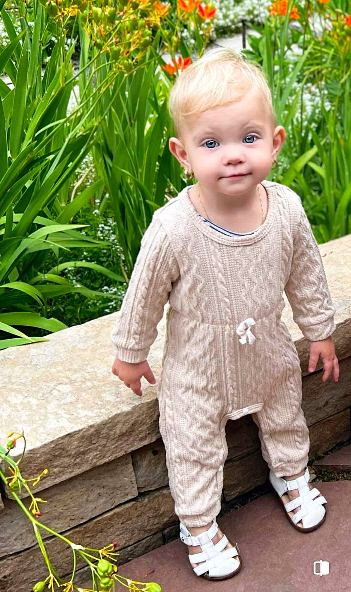 Maria is registered to the contest to win money with this photo: baby, baby_toddler_clothing, beauty, child, dress, footwear, grass, happy, leaf, outerwear, pattern, people_in_nature, person, plant, sitting, skin, sleeve, smile, standing, t_shirt