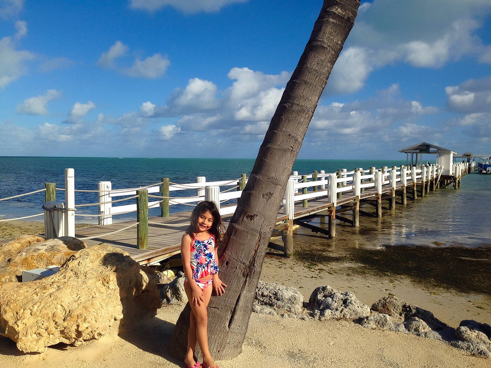 Ariannah joined the competition — help win amazing prizes! azure, beach, boardwalk, bridge, cloud, coast, coastal_and_oceanic_landforms, fun, horizon, joy, leisure, ocean, person, pier, rock, shore, sky, smile, summer, travel