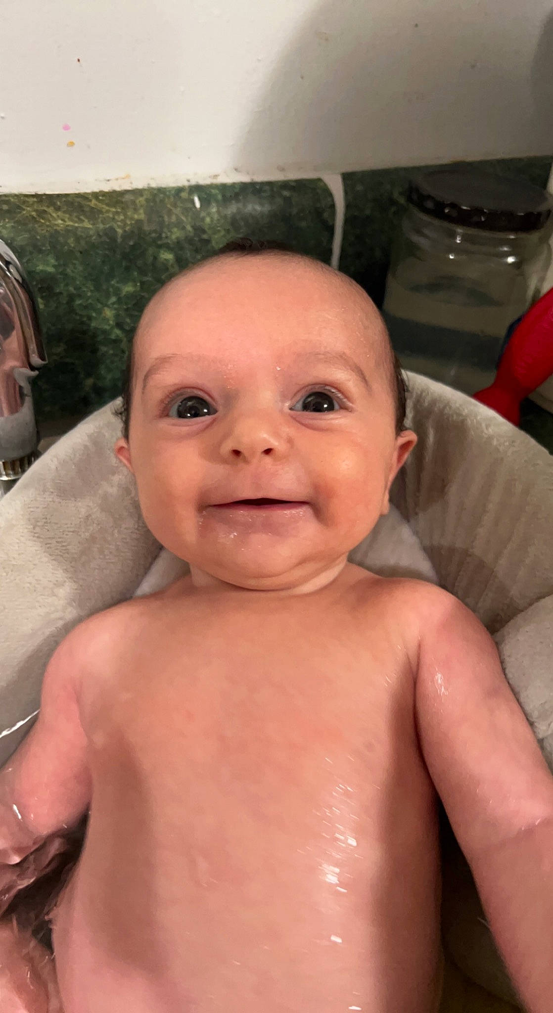 Penelope joined the competition — help win amazing prizes! baby, baby_bathing, barechested, bathing, cheek, chest, chin, eyebrow, eyelash, forehead, iris, lip, mouth, neck, nose, person, skin, smile, thumb, toddler