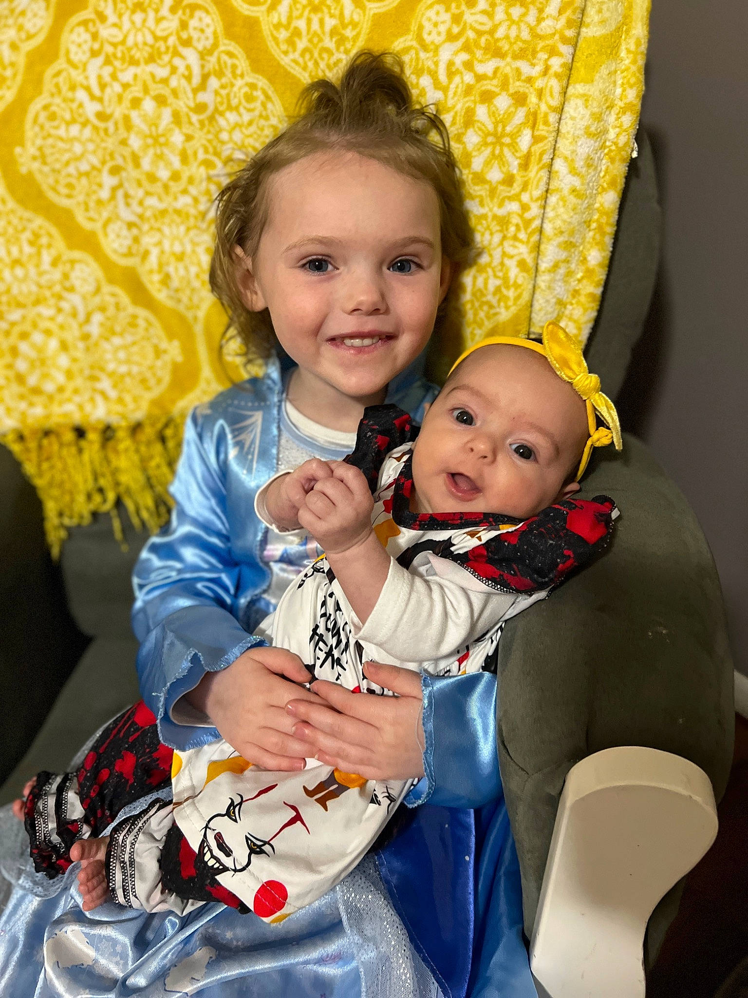 Kaylynn joined the competition — help win amazing prizes! baby, baby_toddler_clothing, chair, child, event, eye, face, fun, hairstyle, happy, head, iris, joy, lap, person, room, sitting, skin, smile, t_shirt