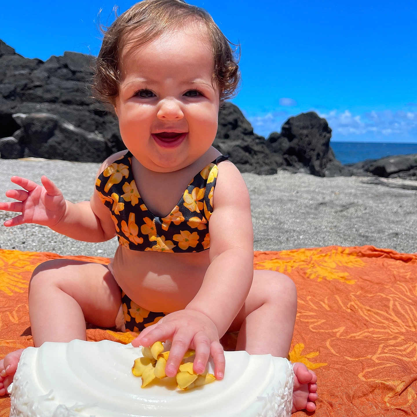 Tilly Rae joined the competition — help win amazing prizes! baby, beach, birthdaycake, cake, coast, cream, dessert, face, food, head, icing, nature, outdoors, person, photography, portrait, rock, sea, shoreline, water