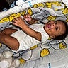 Maziyon joined the competition — help win amazing prizes! baby, infant, bassinet, blanket, elephant_pattern, toy, plush_toy, smiling, happy, child, indoor, person, cute, cozy, white_clothing, relaxing, lying_down, soft_texture, small_hands, portrait
