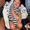 Maziyon joined the competition — help win amazing prizes! baby, infant, child, smiling, striped_clothing, blanket, car_seat, car_interior, happy, cute, portrait, hand, foot, skin, fabric, seatbelt, person, indoor, cozy, toy_pattern