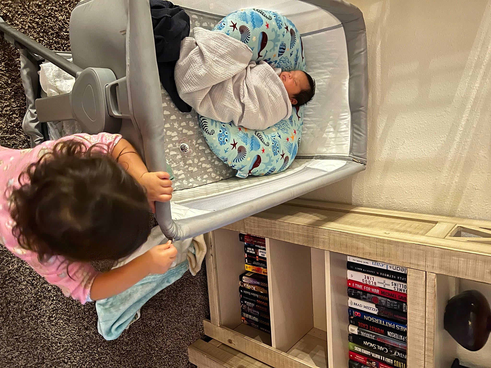 Nalani joined the competition — help win amazing prizes! audio_equipment, baby_products, child, comfort, home_appliance, leisure, linens, machine, major_appliance, nap, pattern, person, public_transport, room, shelf, shelving, sitting, t_shirt, television_set, toddler