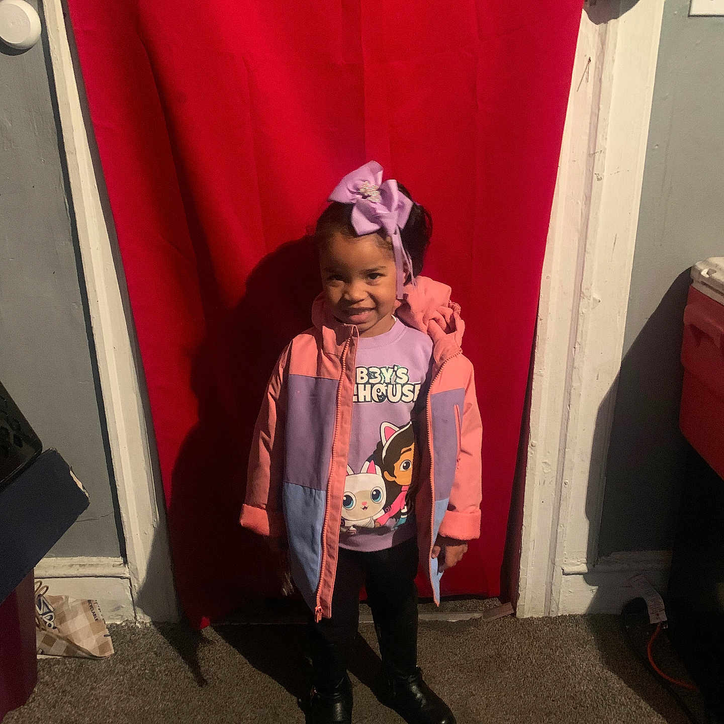 Melanie is registered to the contest to win money with this photo: accessories, bag, cap, child, clothing, coat, door, face, female, footwear, girl, handbag, hat, head, jacket, pants, person, photography, portrait, shoe