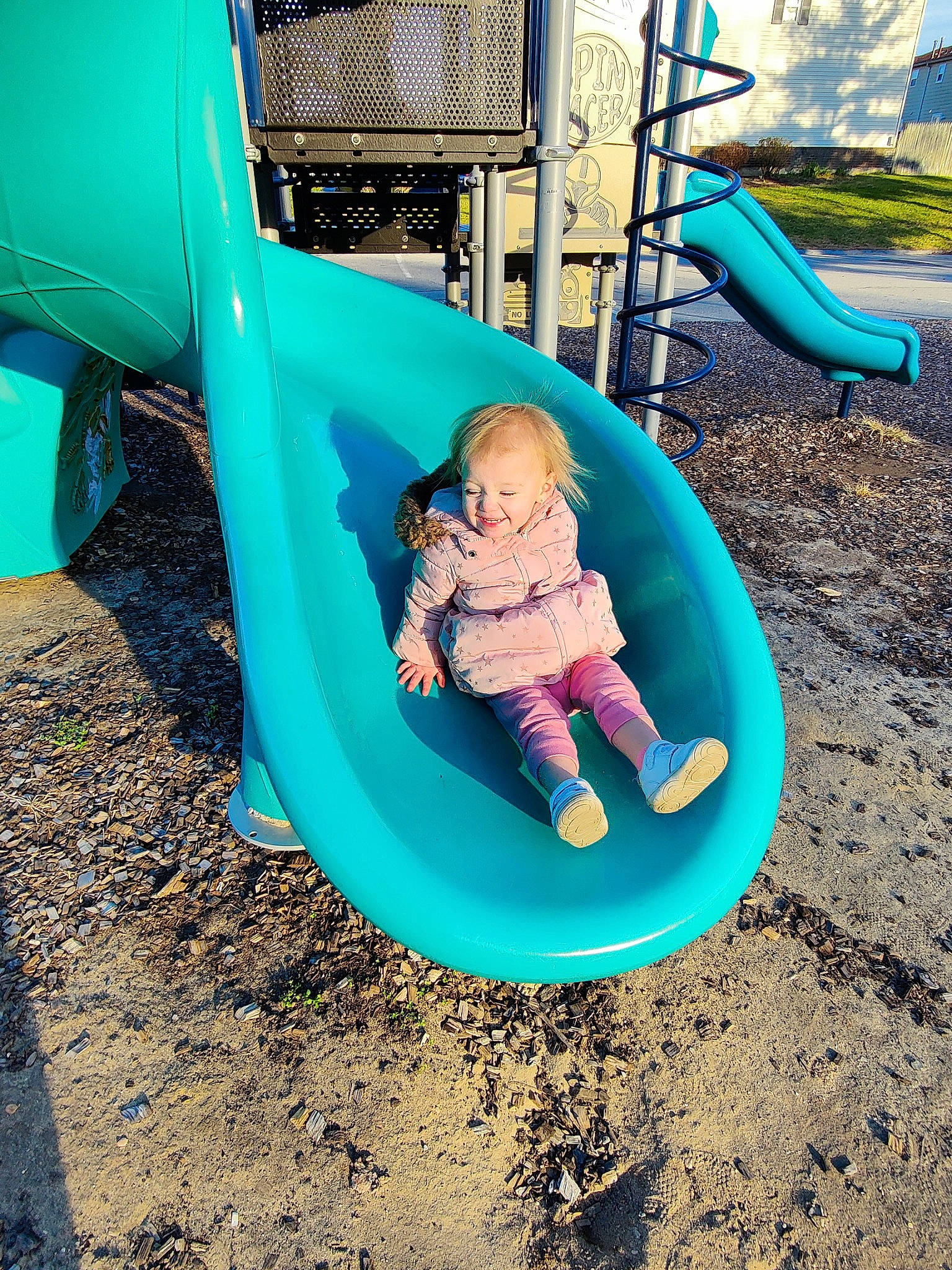 Lyncoln Journey is registered to the contest to win money with this photo: aqua, azure, baby, baby_toddler_clothing, blue, child, chute, city, electric_blue, fun, grass, green, joy, leisure, outdoor_play_equipment, outdoor_recreation, person, playground, playground_slide, public_space