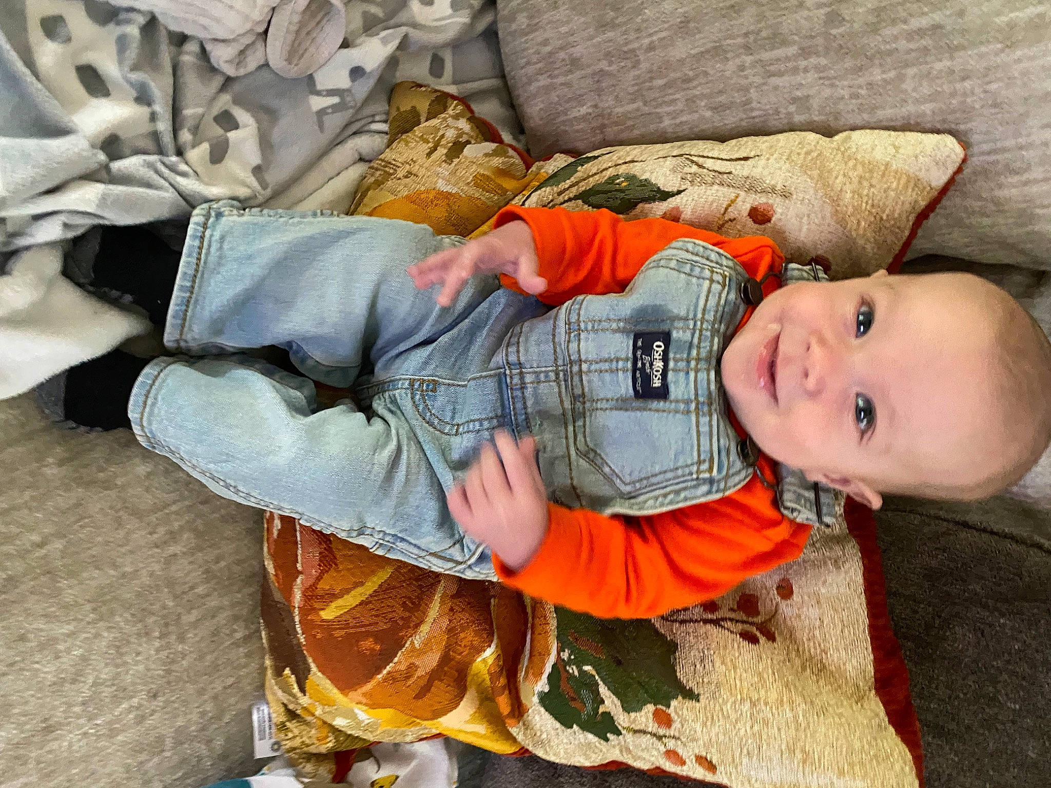 Weston is registered to the contest to win money with this photo: baby, baby_products, baby_toddler_clothing, child, comfort, human_body, human_leg, lap, leg, linens, nap, pattern, person, room, sitting, sleep, sleeve, smile, thigh, toddler