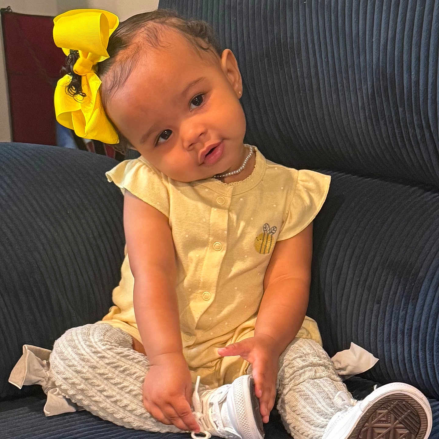 Winter Magnolia is registered to the contest to win money with this photo: accessories, baby, clothing, couch, cushion, face, footwear, furniture, head, homedecor, pants, person, photography, portrait, shoe, shorts, sitting, sleeve, sneaker, t_shirt