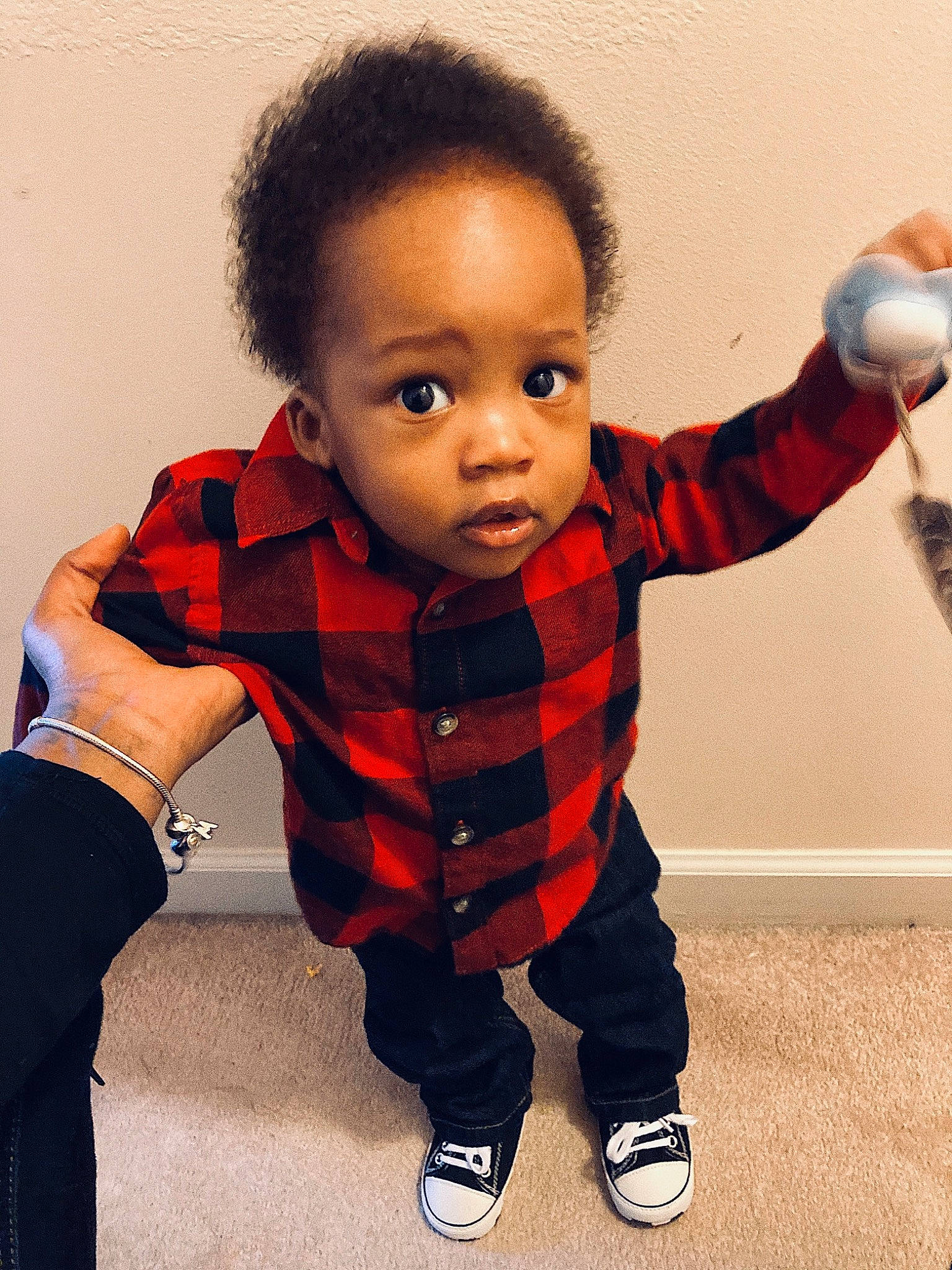Rico is registered to the contest to win money with this photo: arm, baby_toddler_clothing, cheek, eye, face, facial_expression, finger, gesture, hair, hand, happy, head, human_body, joint, leg, neck, nose, person, skin, sleeve