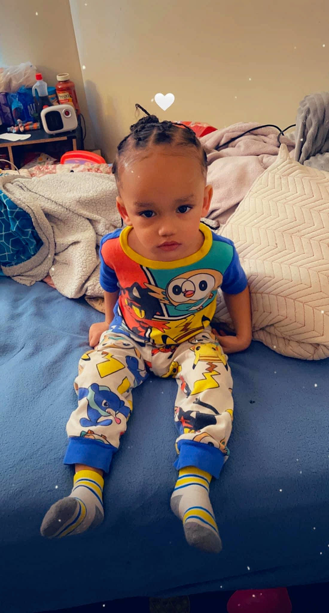 Khristian is registered to the contest to win money with this photo: baby, baby_toddler_clothing, cheek, child, eye, facial_expression, flooring, fun, happy, head, human_leg, iris, pattern, person, personal_protective_equipment, sitting, skin, sleeve, smile, t_shirt