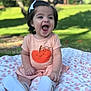apparel, baby, blanket, bow, child, cute, daylight, dress, face, footwear, grass, greenery, happy, infant, nature, outdoor, portrait, pumpkin, sitting, smiling