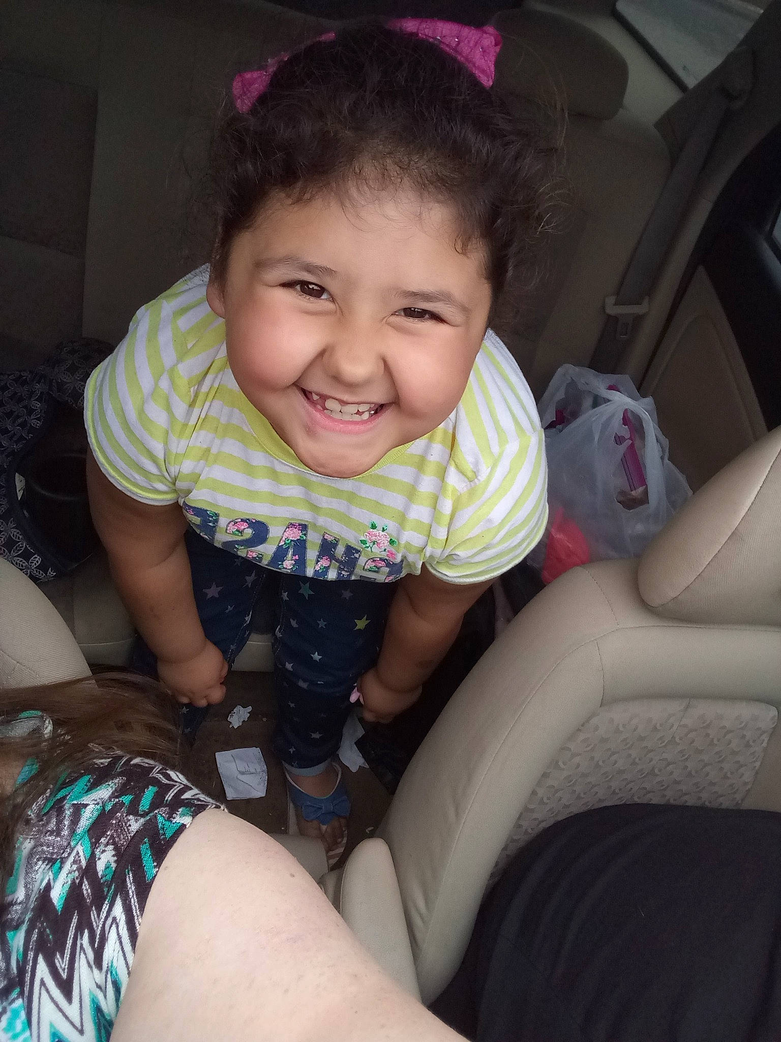 Jasmin is registered to the contest to win money with this photo: car_seat, child, finger, joy, leg, person, sitting, skin, smile, thigh, toddler