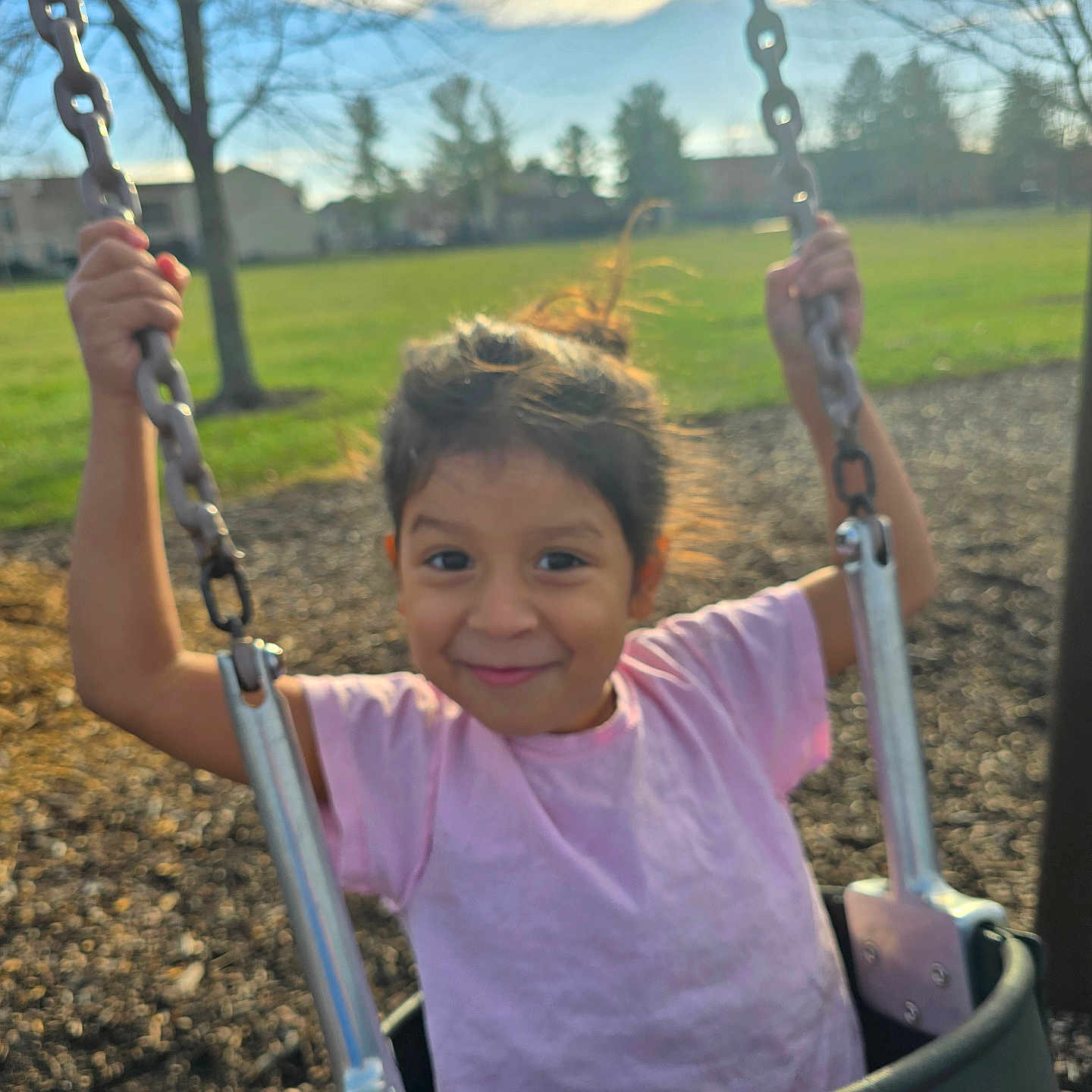 Genesis Tatiana joined the competition — help win amazing prizes! casual_clothing, chain, child, daytime, fun, girl, grass, happy, holding, nature, outdoor, park, person, playground, recreation, smile, sunlight, swing, tree, young