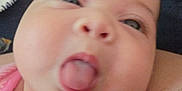 Haley joined the competition — help win amazing prizes! baby, cheeks, child, close_up, cute, expression, face, head, human, indoors, infant, mouth, person, pink_clothing, playful, portrait, skin, soft_focus, tongue, young