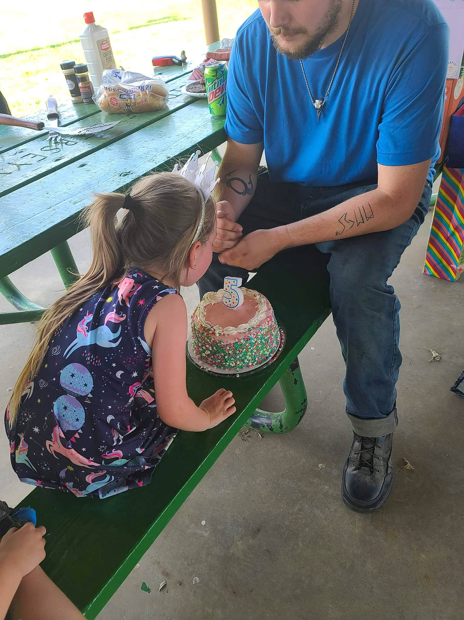 Vada is registered to the contest to win money with this photo: baby, chair, child, cooking, event, fun, grass, happy, headwear, holiday, leisure, pattern, person, play, recreation, sandal, shoe, shorts, sitting, t_shirt