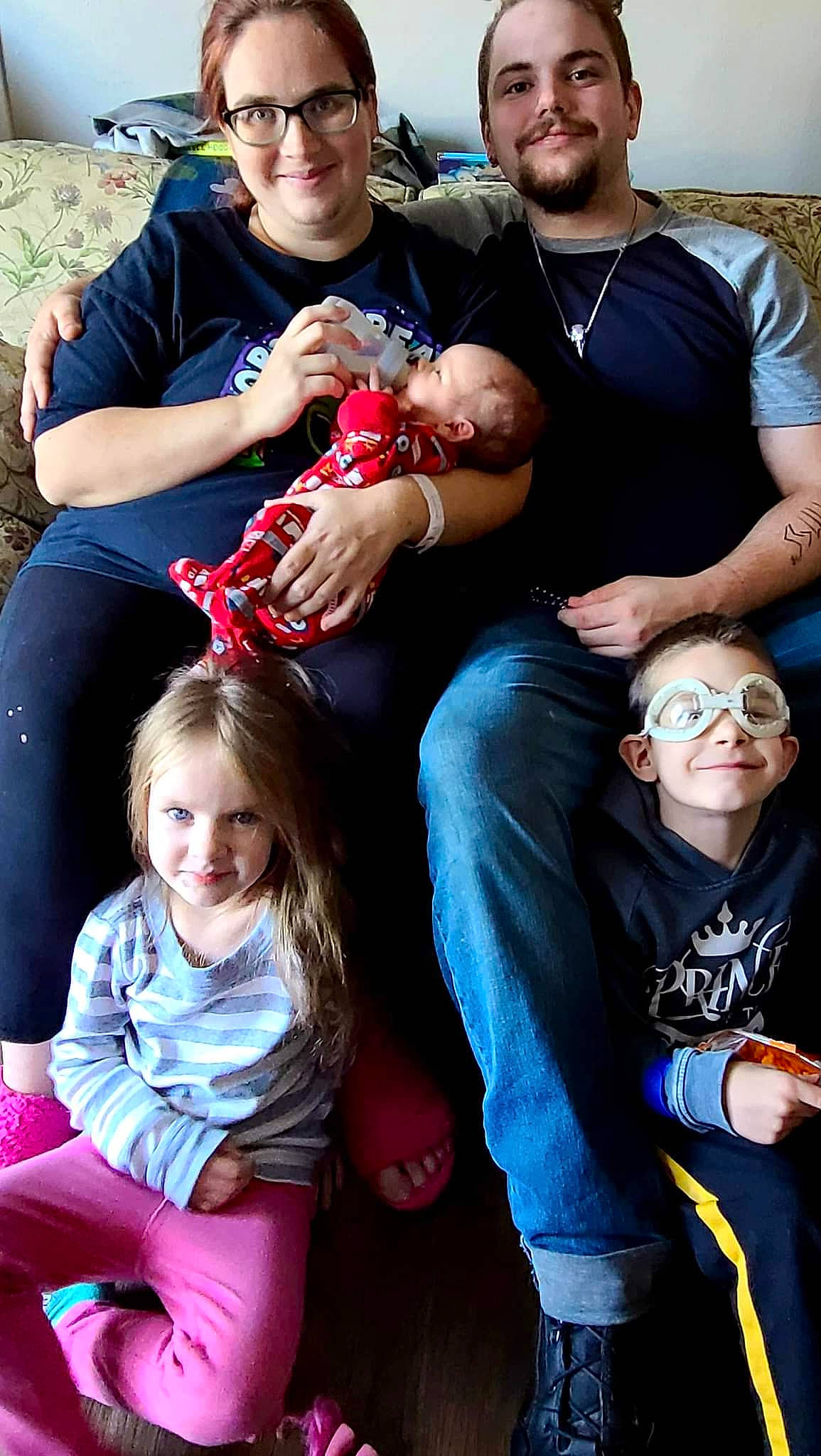 Vada is registered to the contest to win money with this photo: arm, child, clothing, cool, eyewear, facial_expression, friendship, fun, green, happy, jeans, joy, lap, leisure, organ, people, person, photograph, red, smile