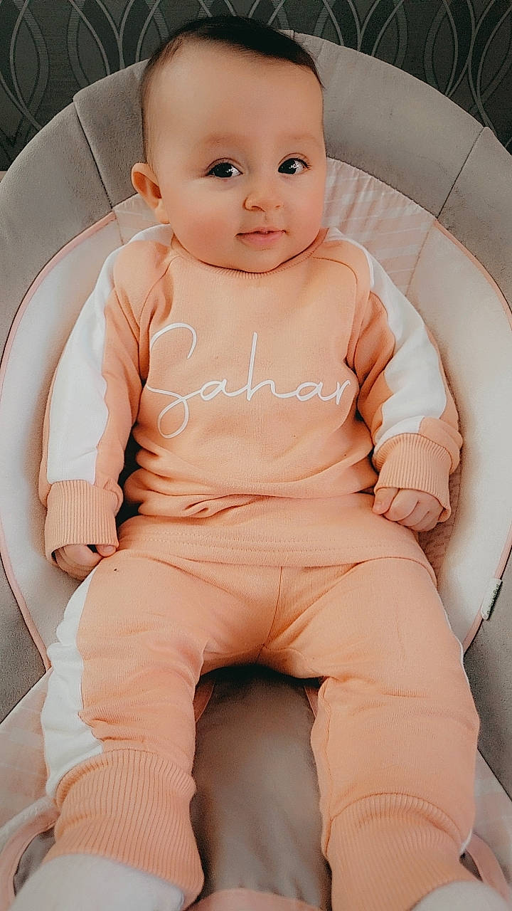 Sahar joined the competition — help win amazing prizes! baby, baby_products, baby_toddler_clothing, cheek, child, comfort, elbow, eyebrow, happy, human_leg, knee, neck, person, pink, sitting, skin, sleeve, smile, stomach, thigh