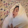 Ryan Mavo is registered to the contest to win money with this photo: baby, infant, child, face, eyes, wide_eyed, towel, blanket, wrapped, portrait, close_up, floral, bedding, indoor, cozy, soft_texture, adult_hand, gentle, cute, photography