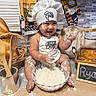 Ryan Mavo joined the competition — help win amazing prizes! baby, child, chef_hat, flour, baking, kitchen, cooking, bowl, dough, bread, bakery, smiling, laughing, sitting, portrait, indoor, apron, food, countertop, playful