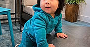 Ryan Mavo joined the competition — help win amazing prizes! toddler, child, baby, face, portrait, curious, surprised, climbing, sitting, teal_clothing, hoodie, sneakers, table, chair, plant, window, indoors, furniture, carpet, playful