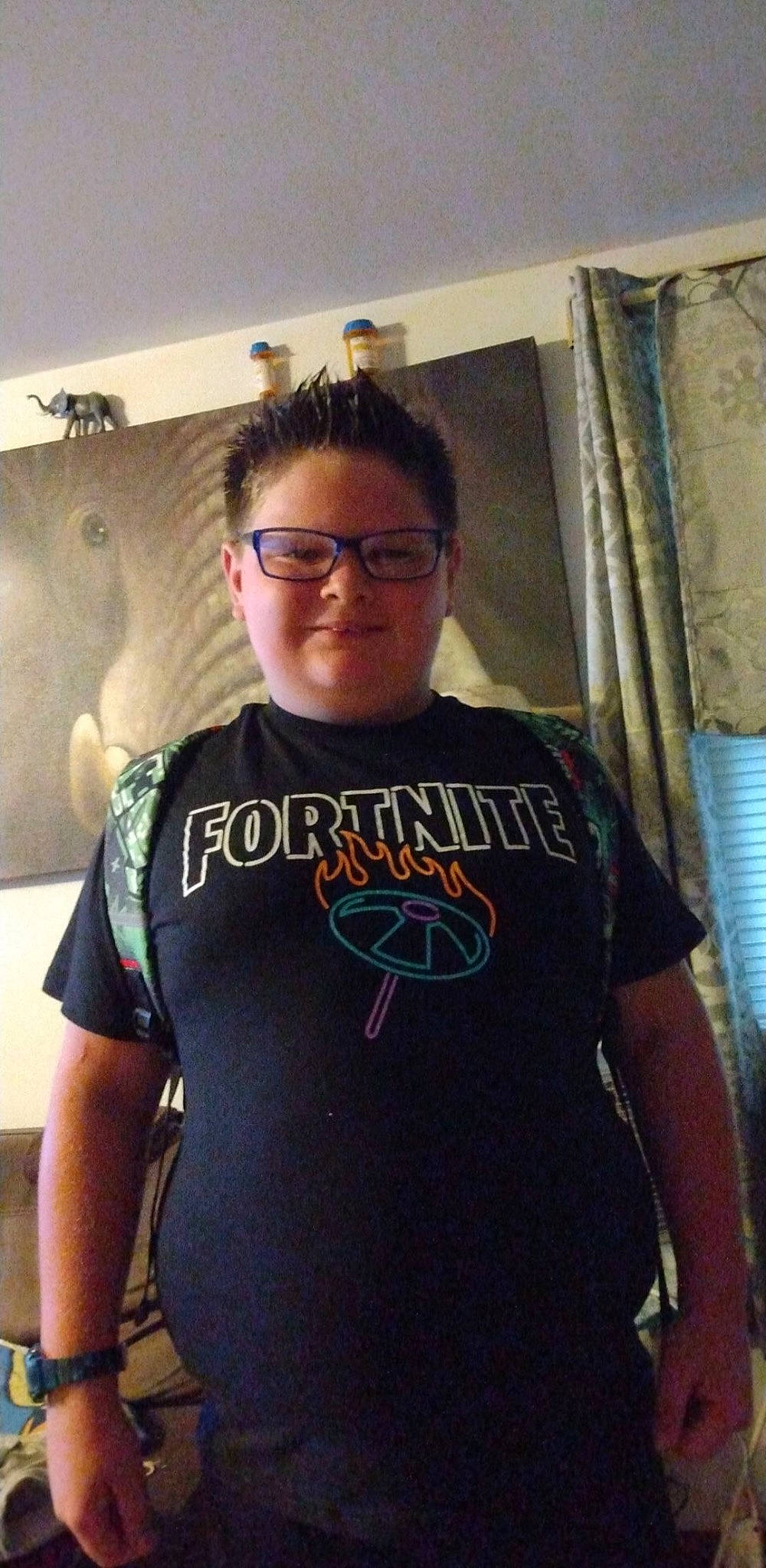 Damian is registered to the contest to win money with this photo: active_shirt, chest, cool, curtain, elbow, electric_blue, eyewear, facial_hair, forehead, fun, glasses, jaw, joint, person, room, selfie, shoulder, sleeve, t_shirt, trunk