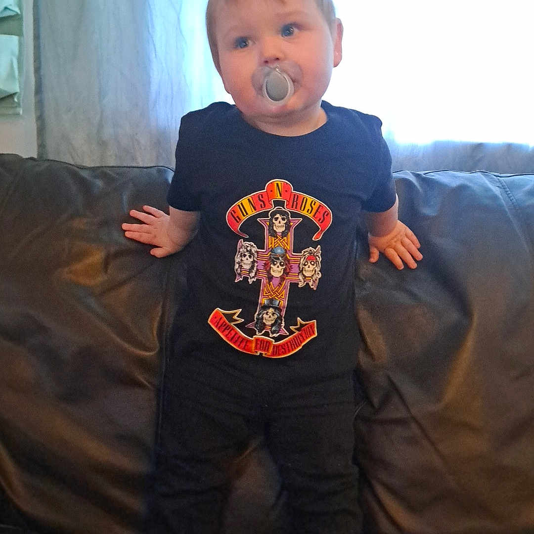 Ethan is registered to the contest to win money with this photo: architecture, boy, building, child, clothing, couch, cushion, face, furniture, head, homedecor, indoors, jeans, livingroom, male, pants, person, photography, portrait, t_shirt