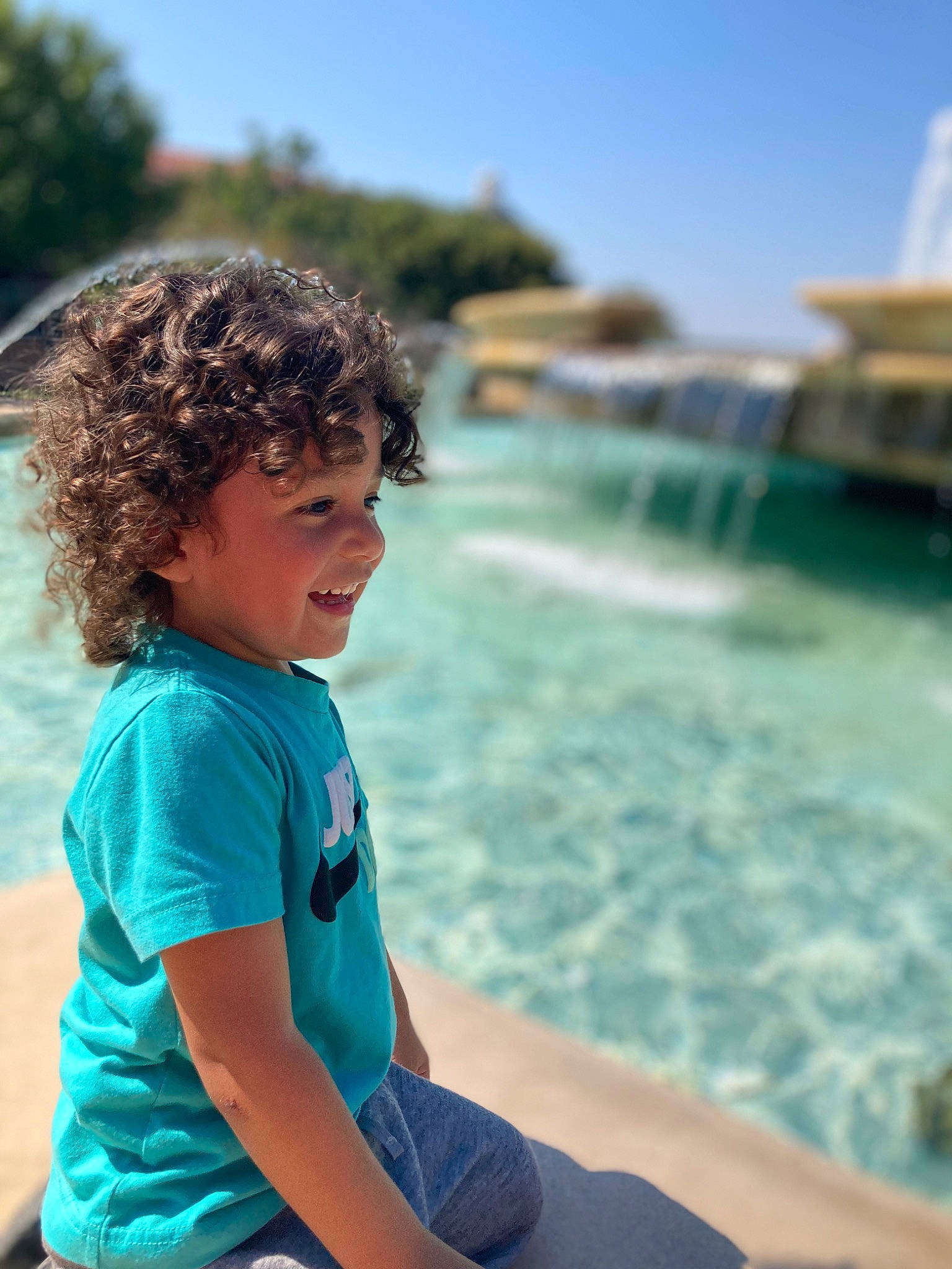 Zayden joined the competition — help win amazing prizes! azure, electric_blue, fun, happy, leisure, ocean, person, recreation, shorts, sitting, sky, summer, swimming_pool, t_shirt, toddler, tourism, travel, tree, vacation, water