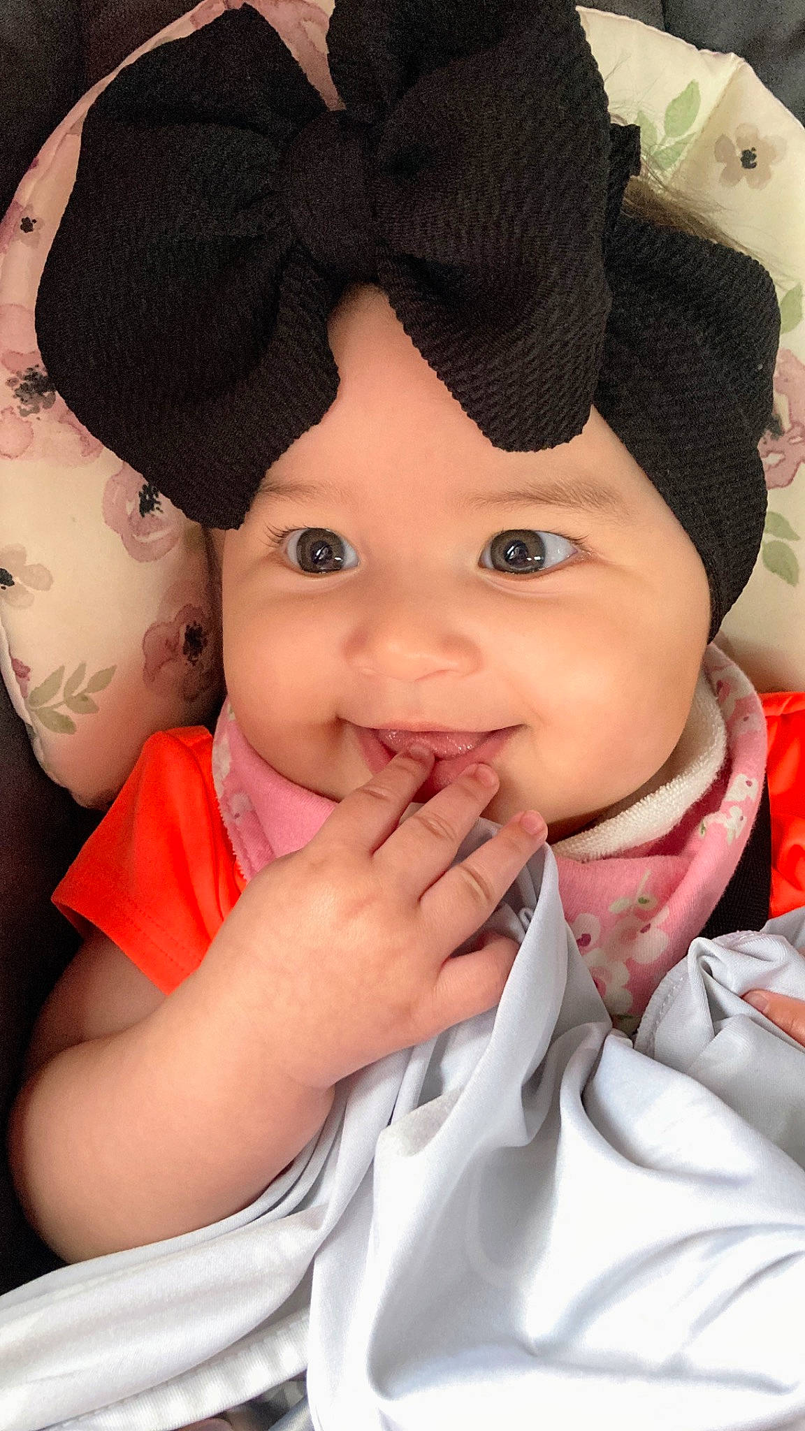 Zoey is registered to the contest to win money with this photo: baby, cap, child, chin, event, face, fashion_accessory, flash_photography, fun, gesture, happy, hat, headgear, lip, outerwear, person, pink, skin, smile, thumb