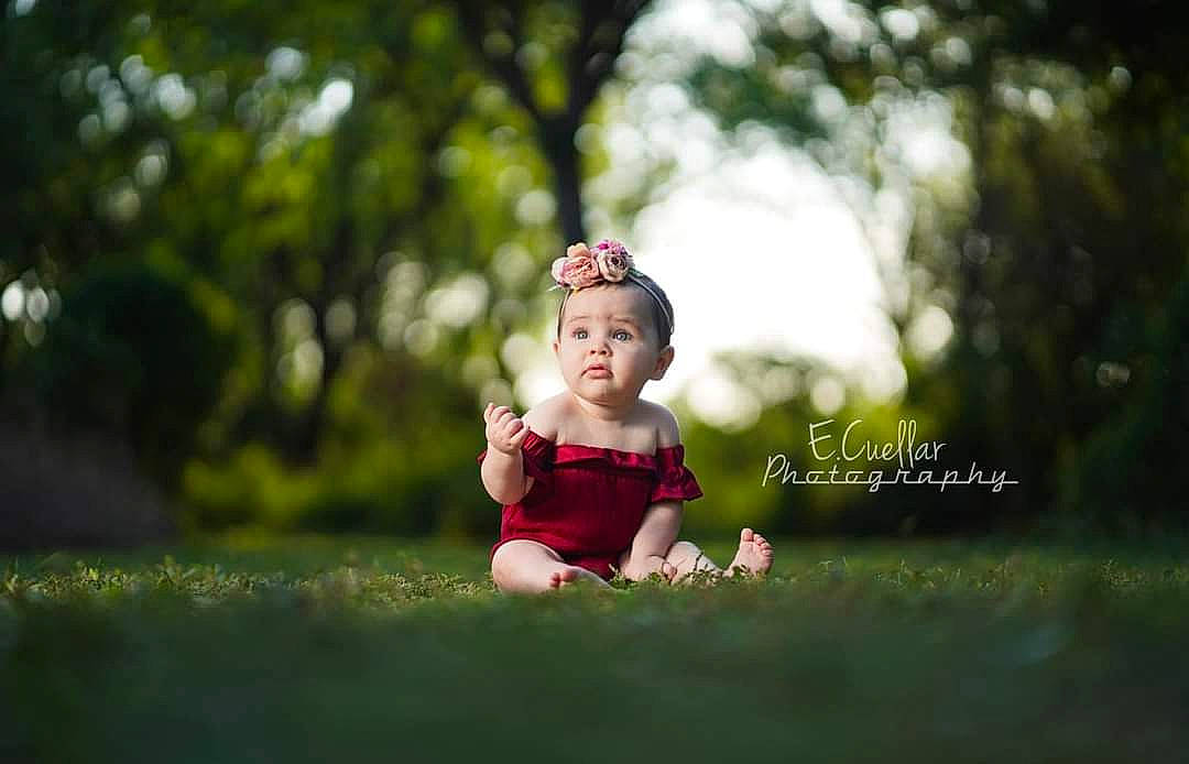 Kaylani is registered to the contest to win money with this photo: baby, child, eye, fun, grass, green, happy, people, people_in_nature, person, photograph, photography, pink, portrait, portrait_photography, red, snapshot, summer, sunlight, toddler