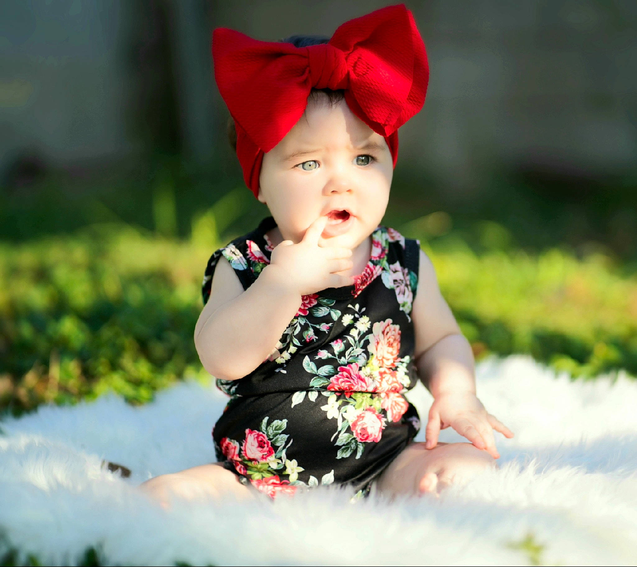 Kaylani is registered to the contest to win money with this photo: baby, baby_toddler_clothing, cap, child, child_model, clothing, costume_accessory, dress, fashion_accessory, flower, hat, headgear, headwear, pattern, person, photography, plant, red, smile, sun_hat