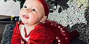 Ivy-Mai joined the competition — help win amazing prizes! baby, carpet, celebration, child, christmas_tree, crawling, cute, decorations, festive, happy, headband, holiday, indoor, infant, portrait, red_clothing, seasonal, smiling, toddler, warm