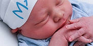 Maddox joined the competition — help win amazing prizes! newborn, baby, sleeping, hat, hand, closeup, infant, soft, blue_clothing, peaceful, cute, skin, fingers, resting, portrait, child, white_background, newborn_hat, gentle, tiny