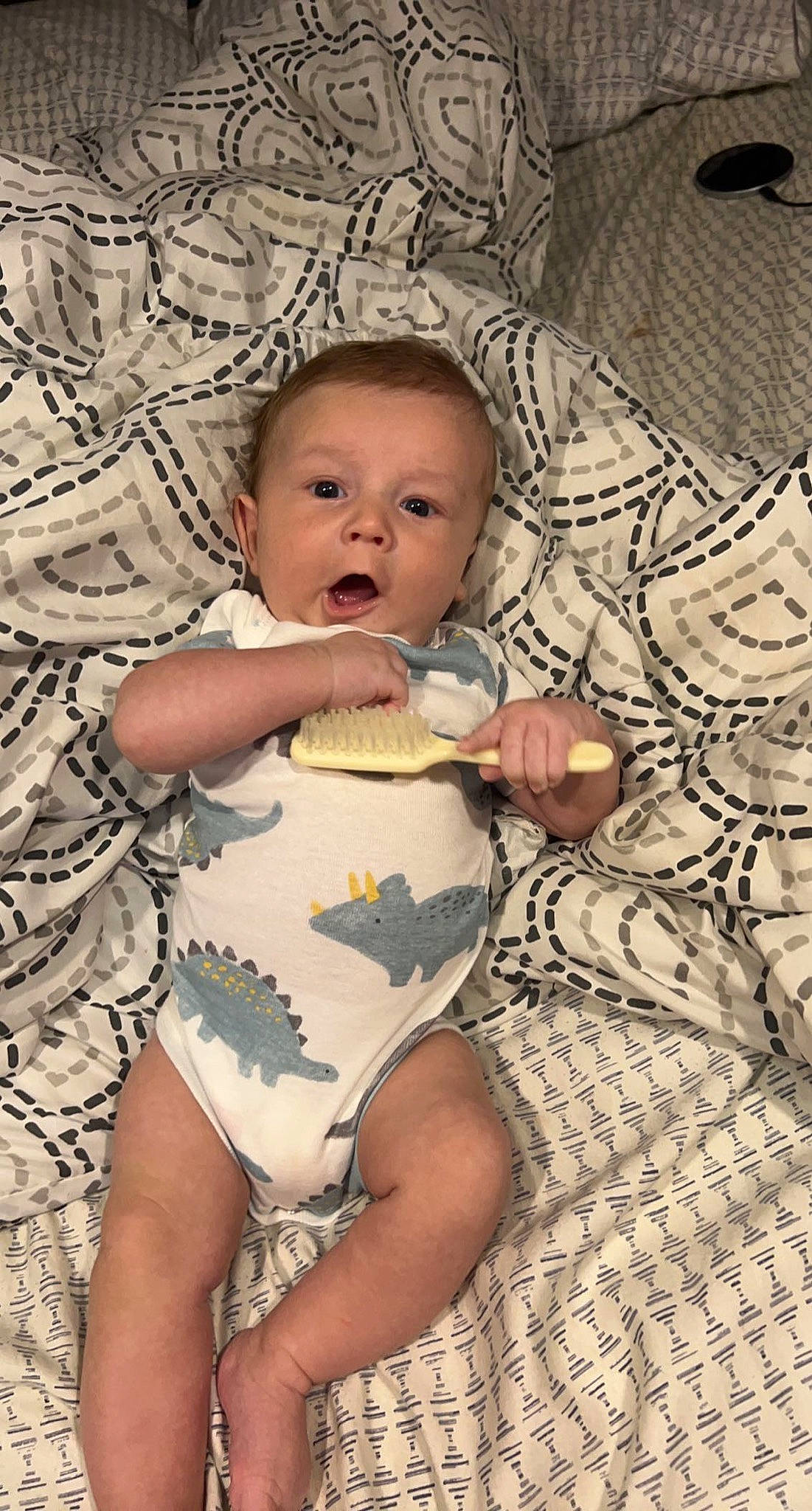 Waylon is registered to the contest to win money with this photo: adaptation, baby, baby_toddler_clothing, cheek, comfort, eye, face, facial_expression, finger, hairstyle, hand, head, human_body, iris, mammal, mouth, person, skin, stomach, surprise