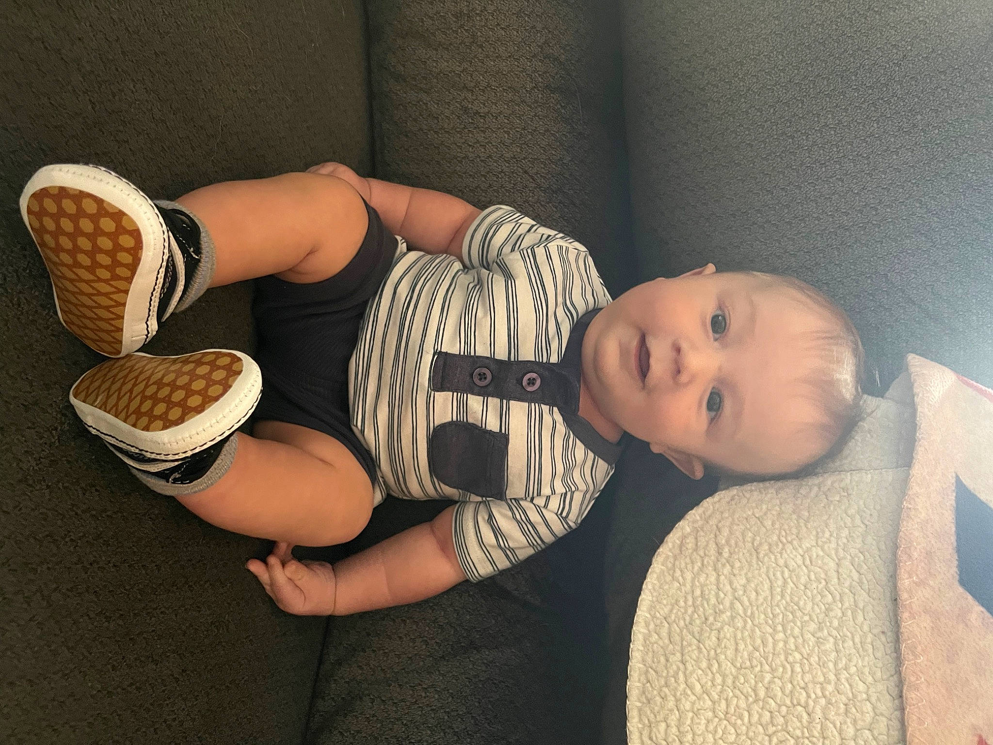 Waylon is registered to the contest to win money with this photo: baby, baby_toddler_clothing, child, comfort, elbow, finger, gesture, glasses, hand, headgear, human_leg, joint, knee, leg, person, shoe, sitting, thigh, thumb, toddler