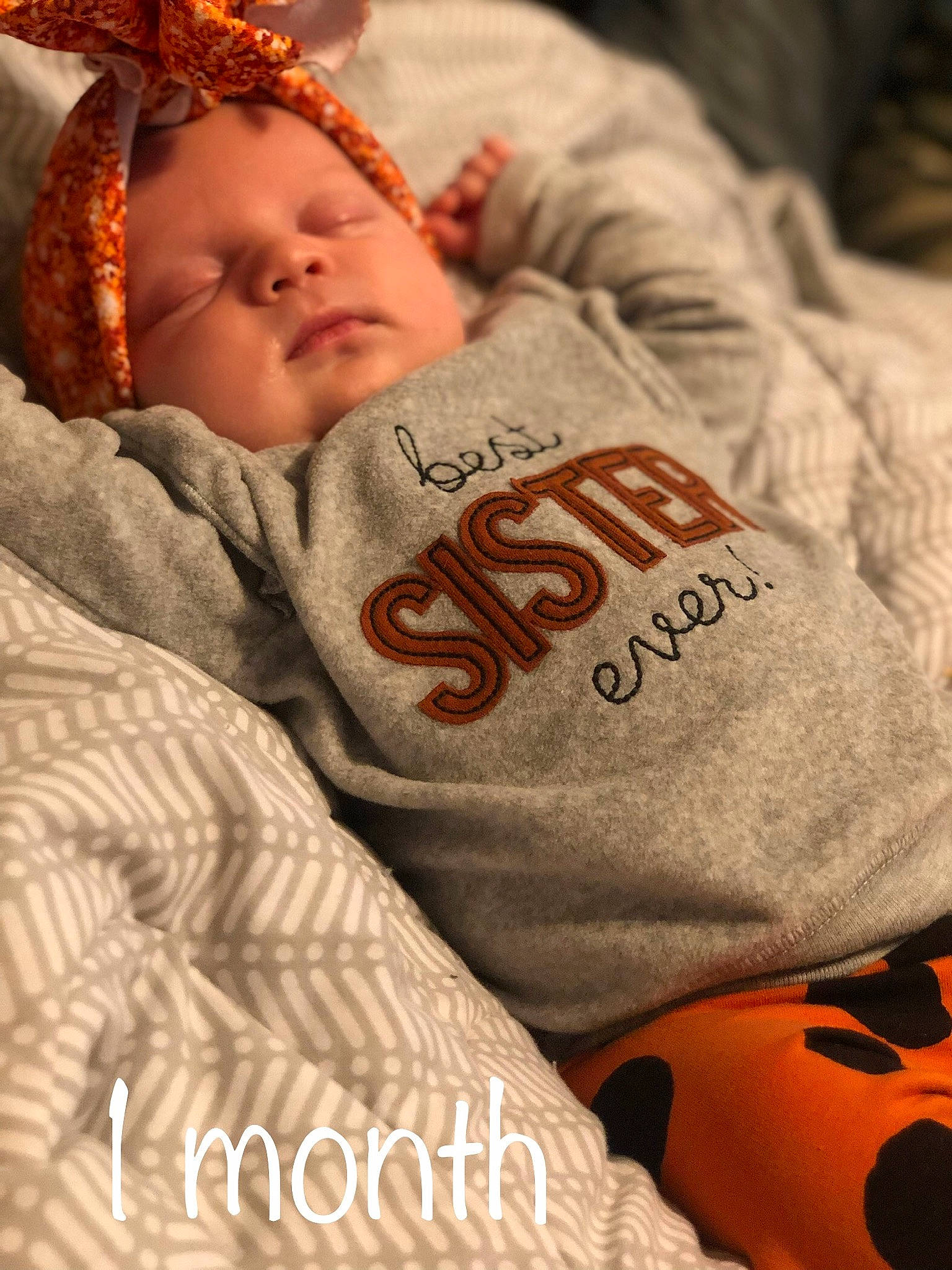 Charlotte Kay is registered to the contest to win money with this photo: baby, baby_sleeping, baby_toddler_clothing, bedtime, child, comfort, eye, font, happy, head, human, human_body, linens, mammal, orange, person, skin, t_shirt, textile, toddler