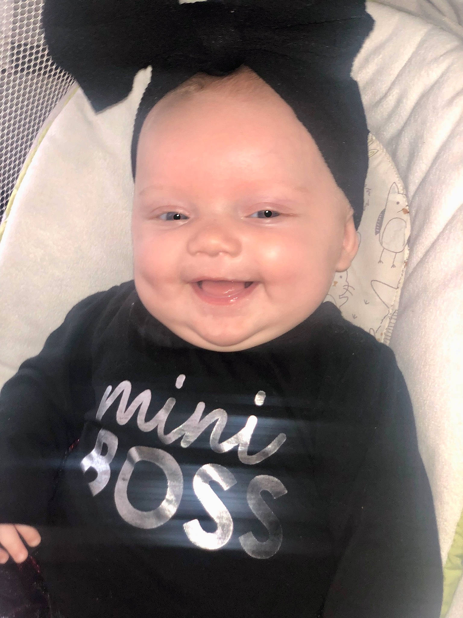 Charlotte Kay is registered to the contest to win money with this photo: baby, baby_toddler_clothing, black, cheek, chin, cool, eye, eyebrow, face, happy, headgear, joy, outerwear, person, product, skin, sleeve, smile, standing, t_shirt