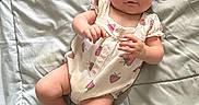 Mckenna joined the competition — help win amazing prizes! baby, baby_clothing, bed, blanket, child, cute, face, flower_shaped_sunglasses, headwear, human, indoor, infant, lying_down, onesie, pink_sunglasses, portrait, relaxed, skin, soft_texture, strawberry_pattern