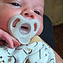 Noah joined the competition — help win amazing prizes! baby, pacifier, infant, close_up, cute, sleepy, clothing, bear_pattern, hand, person, face, skin, eyes, indoors, newborn, soft, comfort, child, apparel, portrait