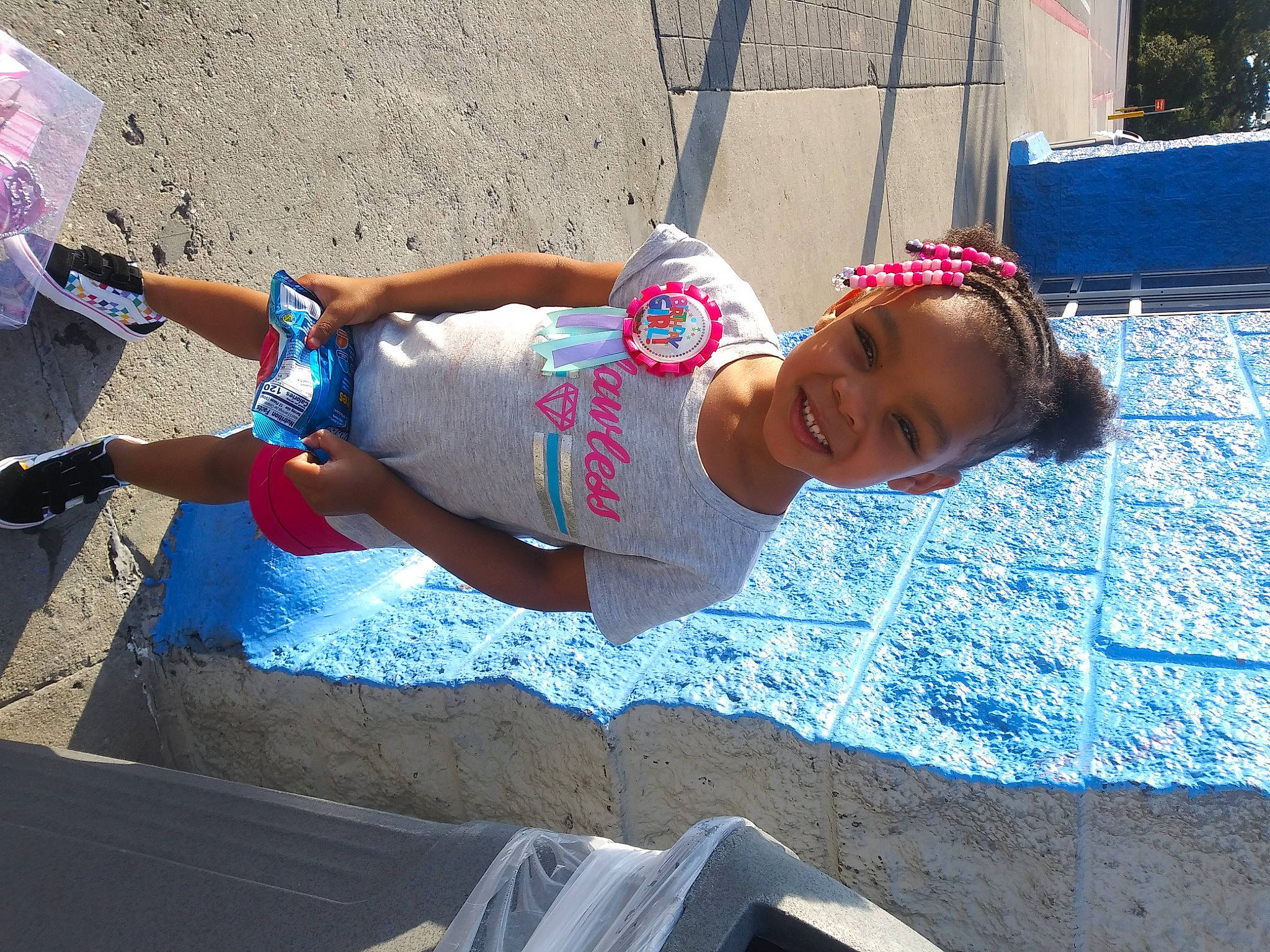 Kai'La is registered to the contest to win money with this photo: child, concrete, fun, joy, person, sun_tanning, vacation