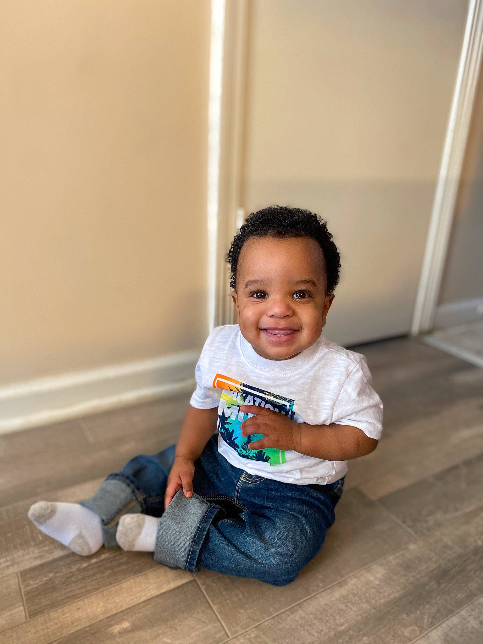 Azuri joined the competition — help win amazing prizes! baby_toddler_clothing, cheek, child, denim, floor, flooring, happy, hardwood, jeans, joy, knee, leisure, outdoor_shoe, person, room, sitting, sleeve, smile, t_shirt, toddler