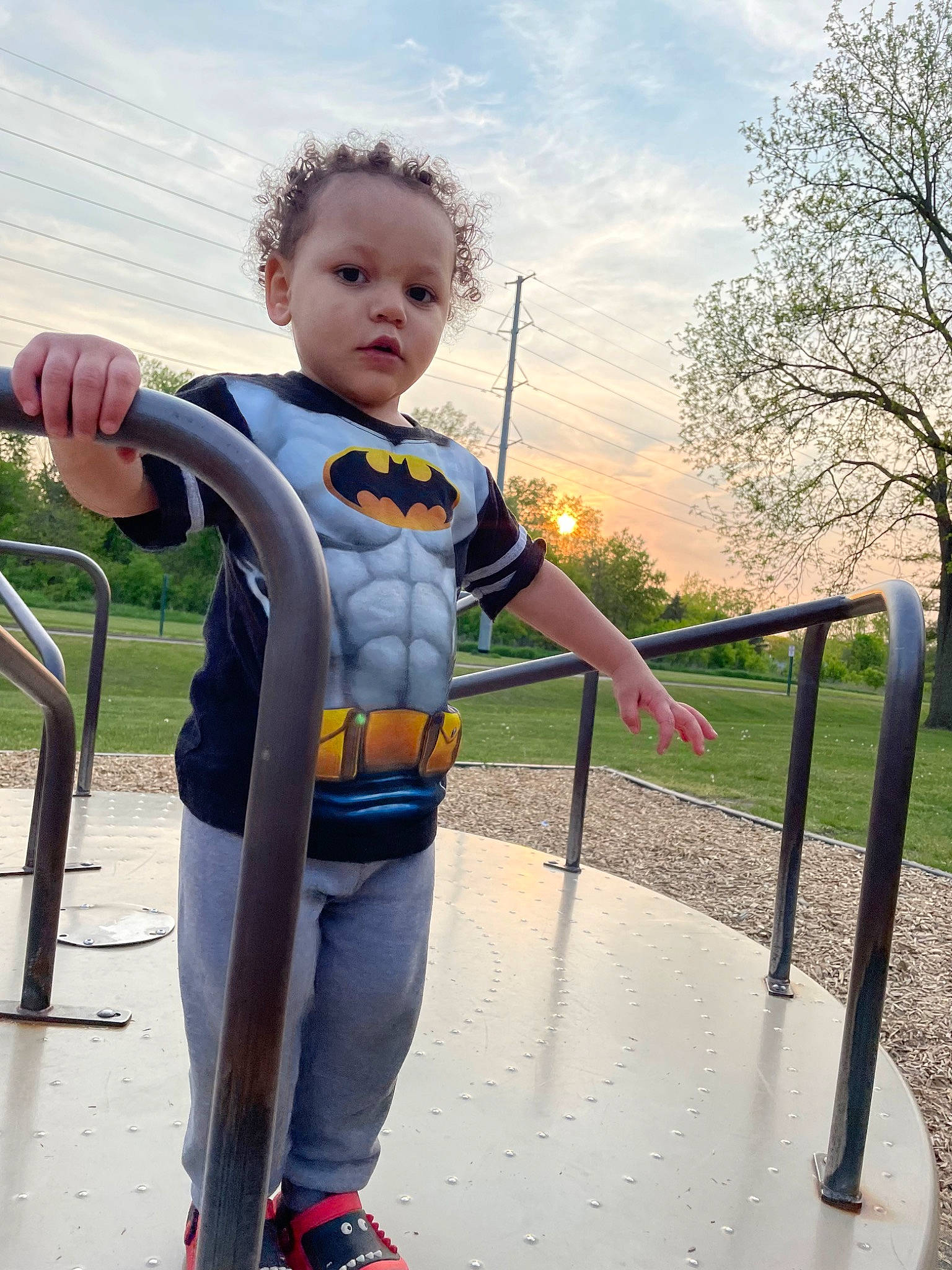 Oliver is registered to the contest to win money with this photo: baby, boats_and_boating_equipment_and_supplies, child, city, cloud, electric_blue, fun, grass, happy, human_settlement, leisure, outdoor_play_equipment, person, personal_protective_equipment, plant, play, recreation, sky, standing, toddler