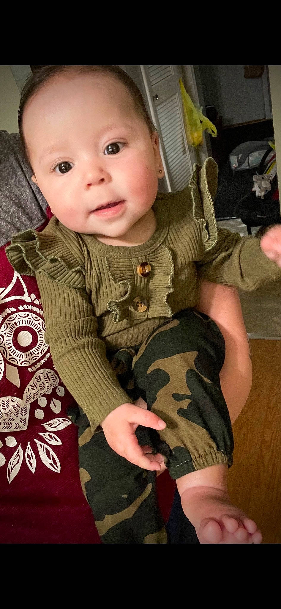 Elayna is registered to the contest to win money with this photo: baby, baby_toddler_clothing, camouflage, cheek, chin, eye, face, gesture, hairstyle, head, iris, lip, military_camouflage, neck, nose, person, pink, skin, sleeve, smile