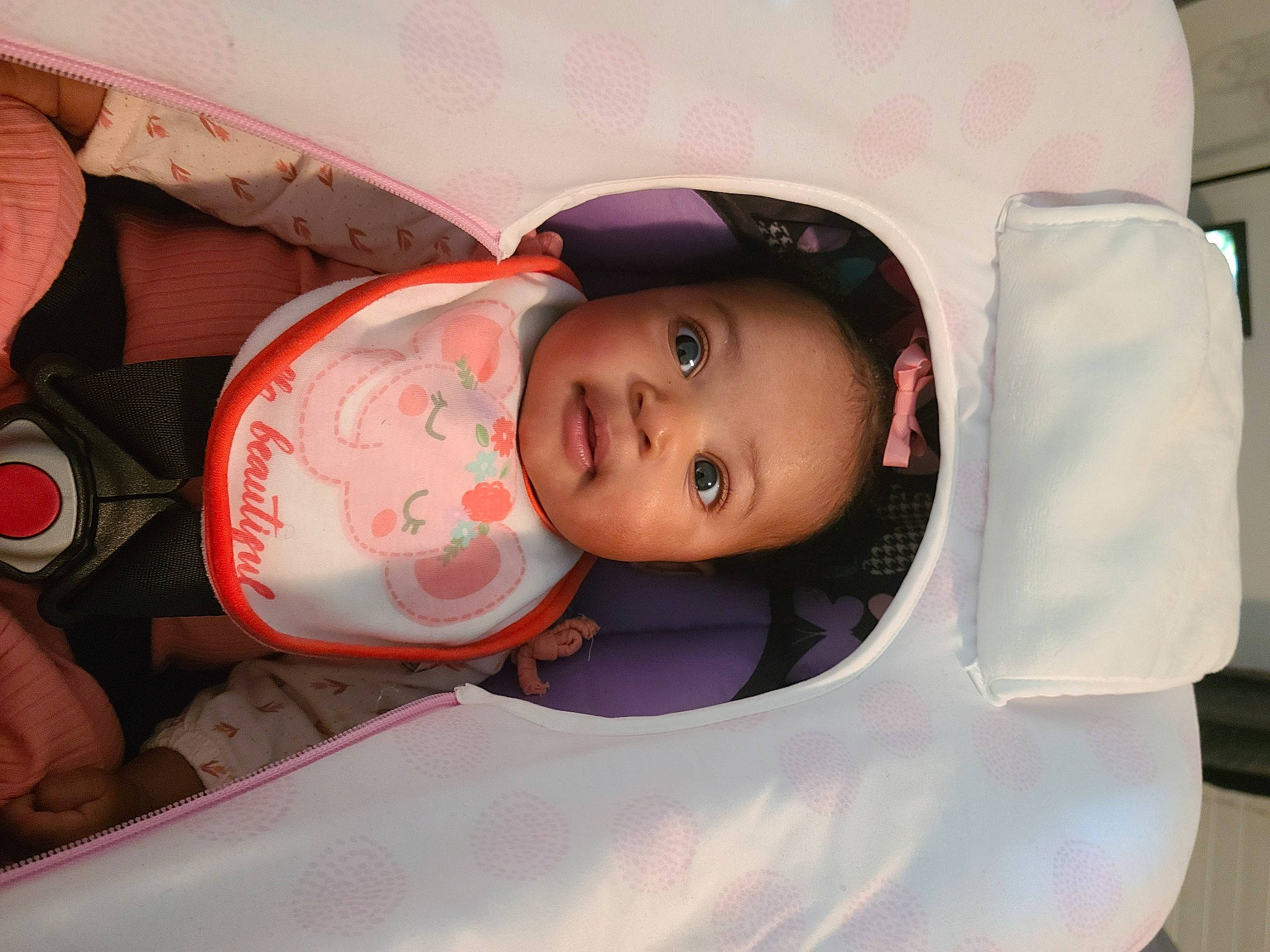 Harmony is registered to the contest to win money with this photo: baby, baby_carriage, baby_products, baby_toddler_clothing, cap, car_seat, carmine, cheek, child, eye, fun, hat, headgear, lip, mouth, person, personal_protective_equipment, pink, sitting, skin