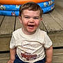 toddler, child, smiling, happy, messy_face, outdoor, wooden_steps, tshirt, jeans, inflatable_pool, summer, playtime, casual_clothing, portrait, cute, sitting, daylight, fun, young_child, messy