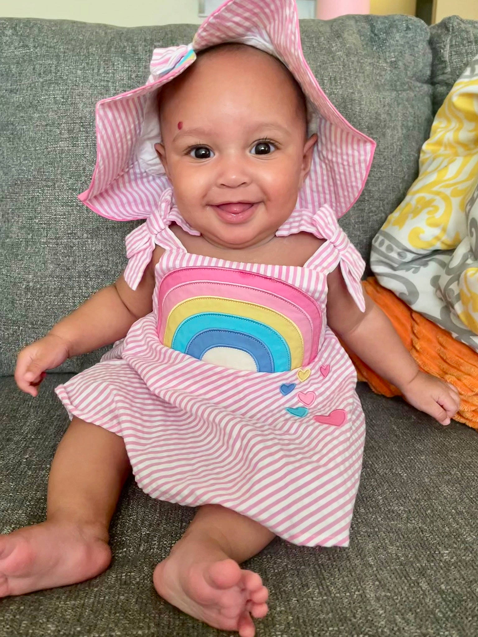 Andrea is registered to the contest to win money with this photo: baby, baby_toddler_clothing, beauty, child, face, facial_expression, fun, happy, head, joy, magenta, pattern, person, pink, product, purple, skin, sleeve, smile, t_shirt