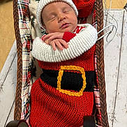 Zayne joined the competition — help win amazing prizes! baby, newborn, sleeping, knitted_clothing, santa_outfit, hat, basket, plaid, blanket, cozy, holiday, christmas, red, white, yellow, black, infant, cute, portrait, indoors