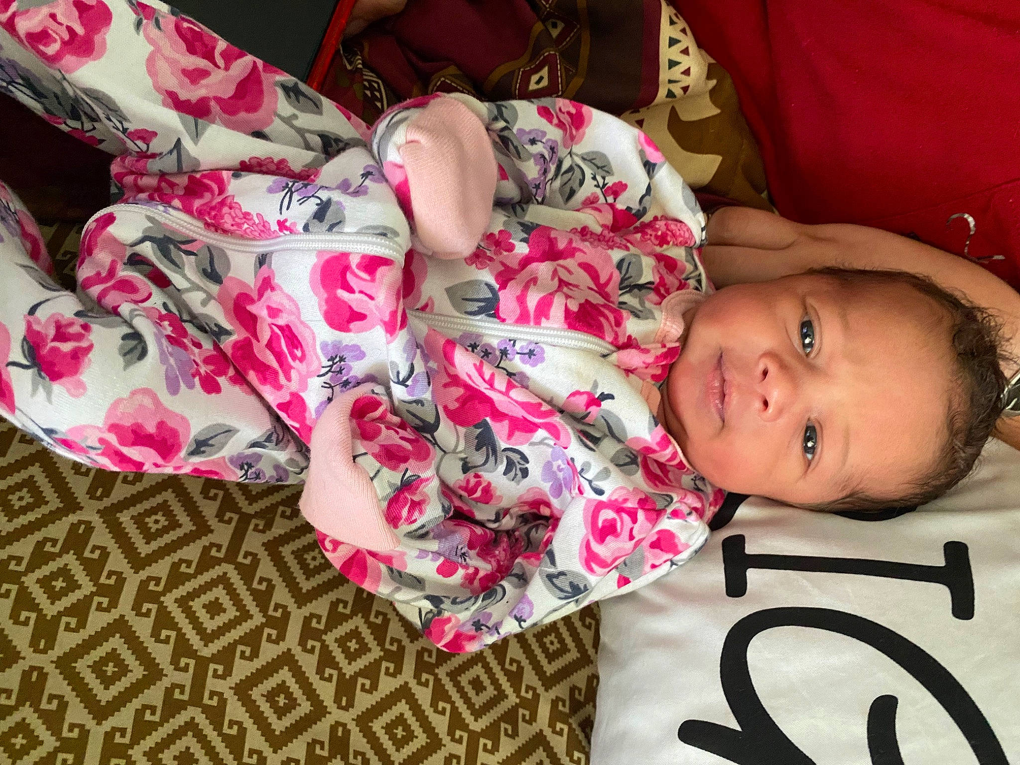 Kehlanie is registered to the contest to win money with this photo: arm, baby_toddler_clothing, cheek, comfort, eye, face, finger, happy, head, human_body, lip, mammal, mouth, neck, nose, person, pink, skin, sleeve, smile