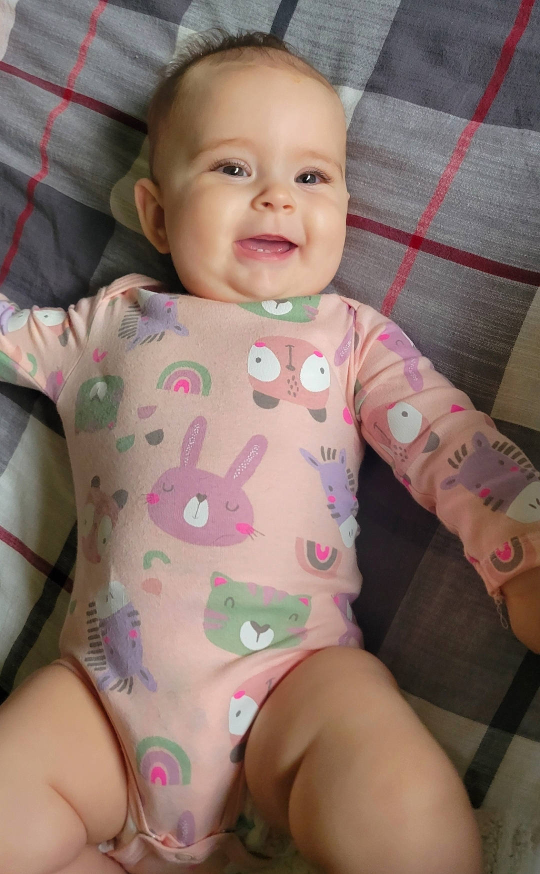 Millie is registered to the contest to win money with this photo: baby, babylaughing, bodypart, clothing, couch, cushion, face, finger, furniture, hand, happy, head, homedecor, laughing, newborn, person, photography, portrait, sitting, smile
