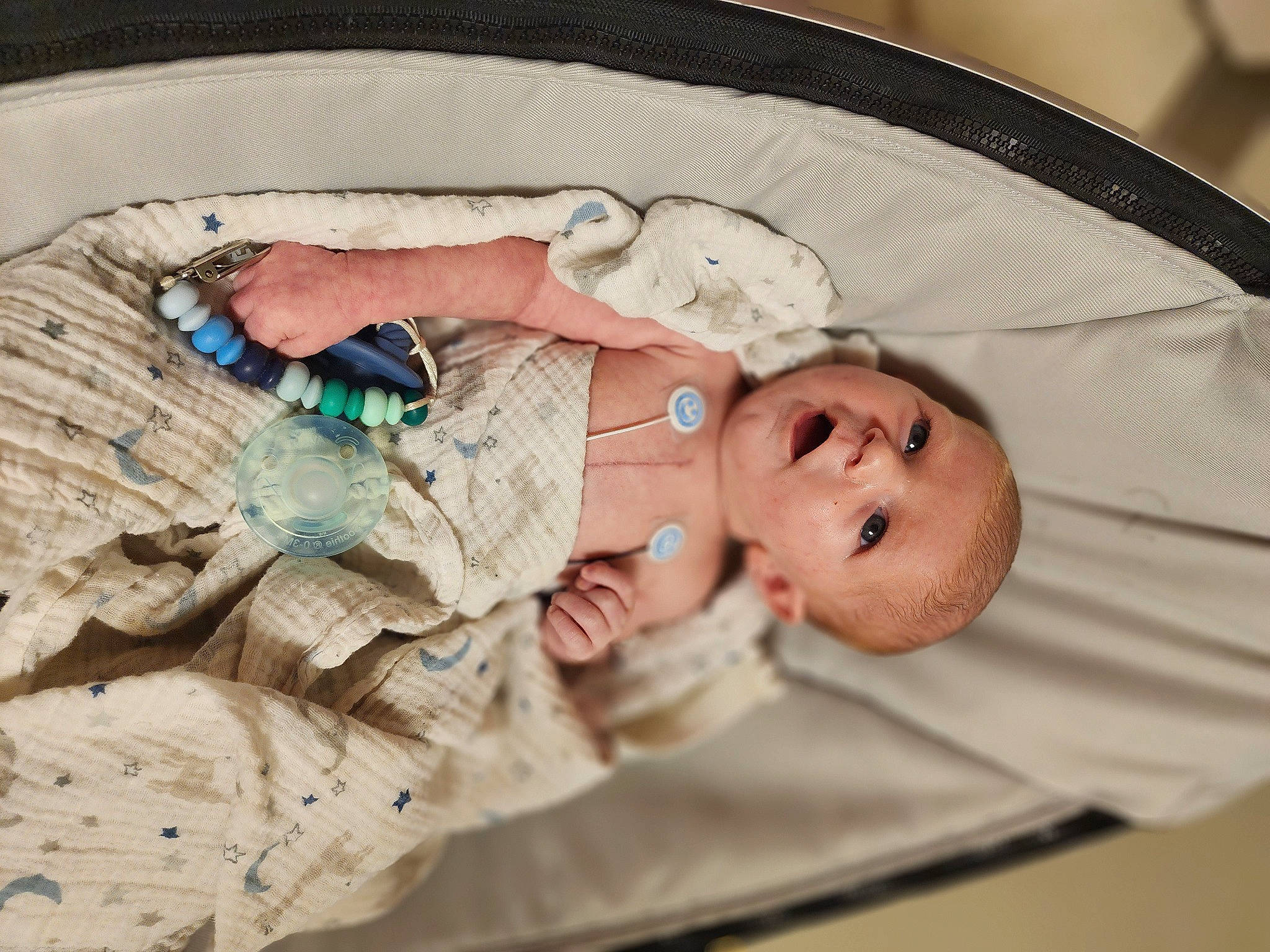 Bryce is registered to the contest to win money with this photo: baby, baby_products, baby_toddler_clothing, child, comfort, event, linens, nail, person, room, textile, thumb, toddler, wood, wrist